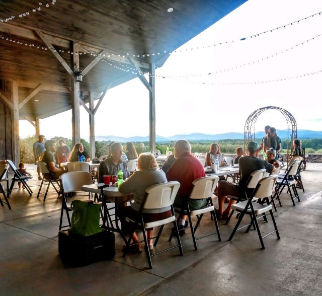tables at September potluck at Chattooga Belle Farm