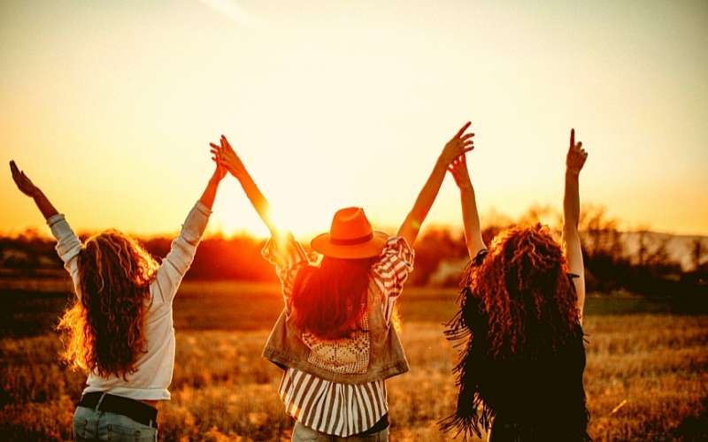 photo of ladies in the setting sun